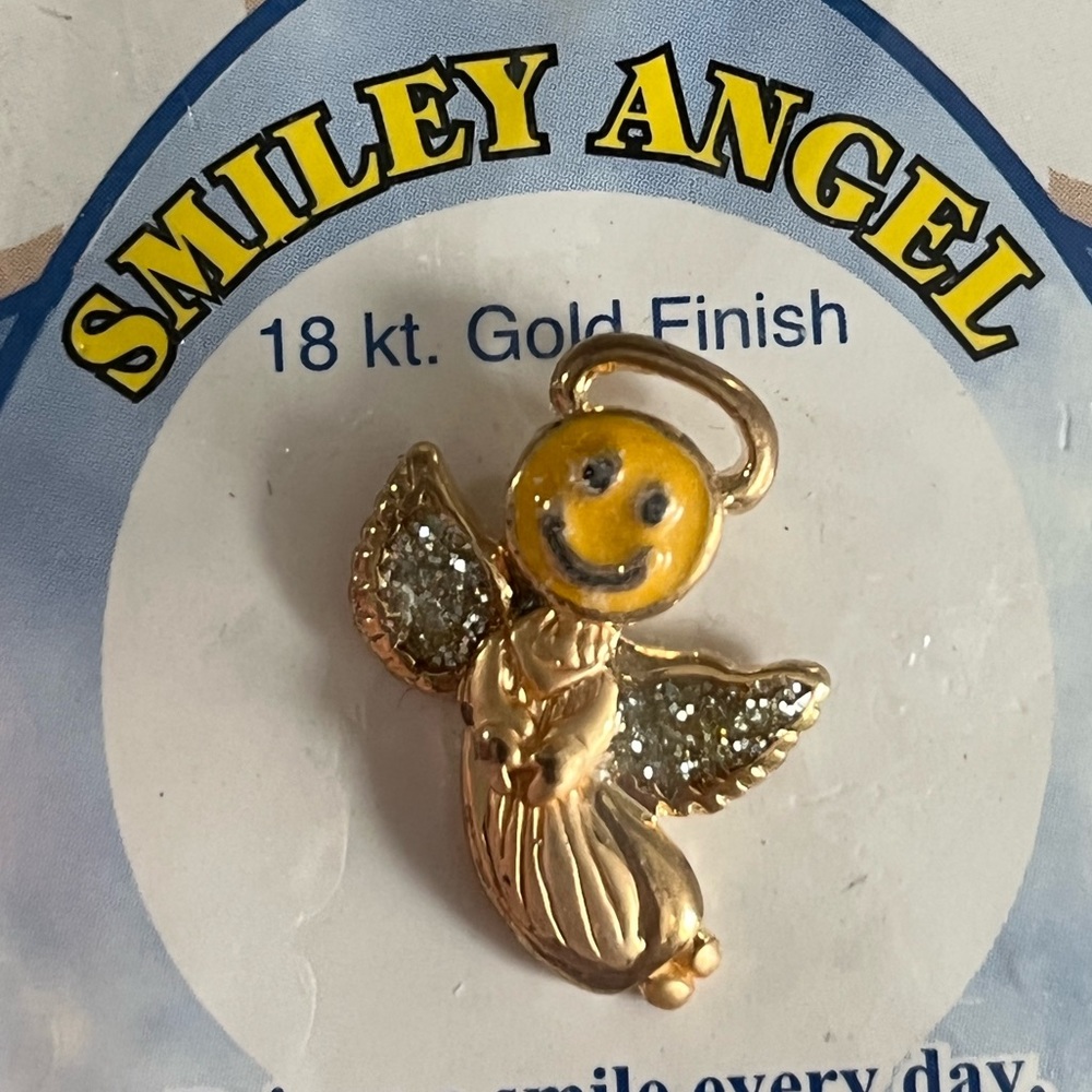 NWOT smiley angel pin.  Smiley angel pin w/sparkly stones in wings. Perfect gift